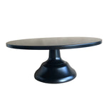 Black cake stand on a light gray background