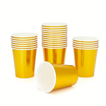 Gold paper cups stacked on a white background