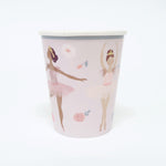 Paper cup with ballerina design on a white background