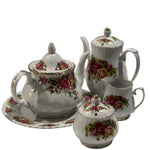Ceramic tea set with floral patterns on a white background