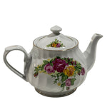 White teapot with floral design on a white background